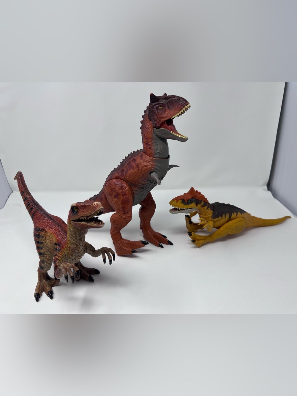 Dinosaur lot 2 Jurassic Park and a velociraptor (not Jurassic p)